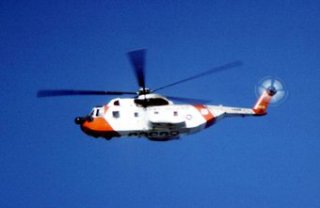Helicopter pilots assist in search and rescue missions.