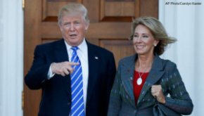 In this Nov. 19, 2016 file photo, President-elect Donald Trump and Betsy DeVos pose for photographs at Trump National Golf Club Bedminster clubhouse in Bedminster, N.J. (AP Photo/Carolyn Kaster, File)