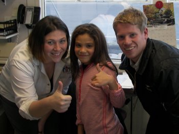 Little Girl with Dispatcher and Flight Instructor after First Flying Lesson