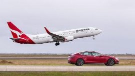 Tesla car races Qantas airliner